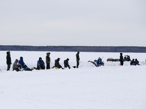 People participate in the fishing derby on Lac La Loche as part of La Loche's winter festival in La Loche, February 23, 2018.