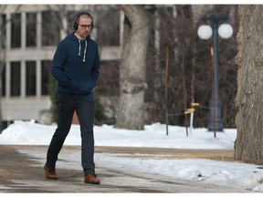 A student walks across the University of Saskatchewan bowl without a jacket or toque - a first sign of spring to come - in Saskatoon on February 26, 2018.