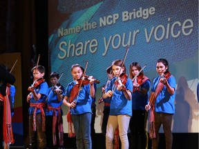 The St. Michael school fiddle program performs the Metis national anthem during the Name the North Commuter Parkway Bridge (NCP) project media event at the Roxy Theatre in Saskatoon on February 27, 2018.