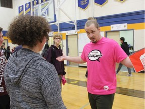 Scott McHenry, a former Saskatchewan Roughrider and bullying expert with the Red Cross, speaks with students at E.D. Feehan Catholic High School about the importance of Pink Shirt Day on Feb. 27, 2018. With Pink-Shirt celebrations set to take place across Canada on Feb. 28, organizers with the Red Cross say the campaign still resonates with Saskatchewan students ten years after its inception, with more than 100 schools across the province taking part.