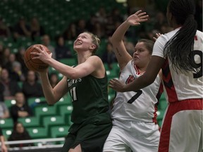 Huskies forward  Summer Masikewich goes to shoot the ball as Winnipeg Wesmen guard Robyn Boulanger  during the game at the Ron and Jane Graham Court  in Saskatoon, SK on Friday, February 16, 2018.