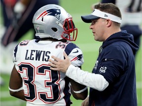 Offensive coordinator Josh McDaniels talks with Dion Lewis #33 prior to Super Bowl LII against the Philadelphia Eagles at U.S. Bank Stadium on February 4, 2018 in Minneapolis, Minnesota.