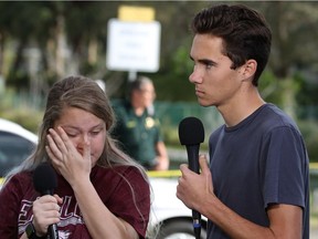 Students Kelsey Friend, left, and David Hogg recount their stories about a mass shooting at the Marjory Stoneman Douglas High School where 17 people were killed, on February 15, 2018 in Parkland, Florida.