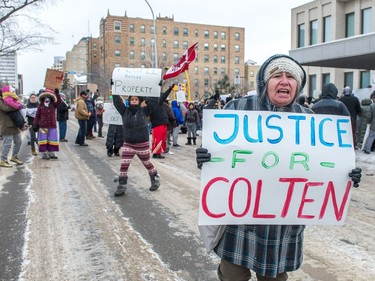 Protesters wave signs on Victoria Avenue outside of Regina's Queen's Bench Court on Feb. 10, 2018, the day after Gerald Stanley was acquitted of all charges relating to the shooting death of Colten Boushie.