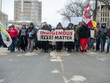 Protesters march along Victoria Avenue outside of Regina's Queen's Bench Court on Feb. 10, 2018, the day after Gerald Stanley was acquitted of all charges relating to the shooting death of Colten Boushie.