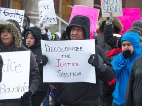 Protesters march along Victoria Avenue in Regina on Feb. 10, 2018, the day after an all-white jury acquitted Gerald Stanley of all charges relating to the shooting death of Colten Boushie.