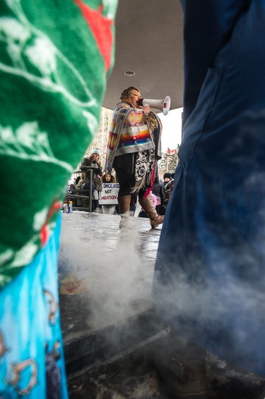 FSIN Vice-Chief Heather Bear addresses protestors outside of Regina's Queen's Bench Court the day after Gerald Stanley was acquitted of all charges relating to the shooting death of Colten Boushie. Smoke from a smudging can can be seen drifting into the foreground on Feb. 10, 2018.
