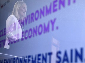 The federal environment minister is today encouraging Saskatchewan to sign on to its national climate plan. Minister of Environment and Climate Change Catherine McKenna is reflected in a TV screen as she speaks during a press conference in the National Press Theatre in Ottawa on February 8, 2018.