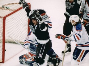 Oct . 15,1989. LA Kings captain and ex-Edmonton Oilers Wayne Gretzky celebrates scoring his 1851st point against Edmonton Oilers Bill Ranford on Oct 15, 1989. The 1851 points broke hockey legend Gordie Howe's NHL record of 1,850. In typical Gretzky fashion he scored the record setting point with only 53 seconds left in the third period, he then scored the goal to win the game in overtime against his old team.