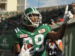 Saskatchewan Roughriders wide receiver Duron Carter celebrates a touchdown by taunting Winnipeg Blue Bombers fans during first half CFL action in Regina on Sunday, September 3, 2017.