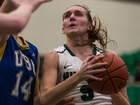 University of Saskatchewan Huskies forward Megan Lindquist, right, battles for the ball with University of British Columbia Thunderbirds forward Susan Thompson in U SPORTS women's basketball action at the PAC.