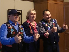 Metis Nation-Saskatchewan President Glen McCallum, Minister Carolyn Bennett of Indigenous-Crown Relations and MN-S Vice President Gerald Morin give thumbs up after signing a memorandum of understanding on recognition of Indigenous rights and self determination, Feb. 22, 2018 in Ottawa. (Arash Rasekhi-Nejad)