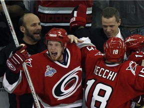Former University of Saskatchewan Huskies trainer Peter Friesen (back, left) celebrated a Stanley Cup win with the NHL's Carolina Hurricanes in 2006.