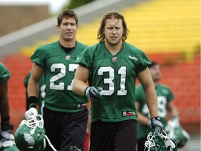 Saskatchewan Roughrider linebackers Brian Peters (#27) and Sam Hurl (#31) during a Rider practice held at Mosaic Stadium in Regina, Sask. on Tuesday June 24, 2014.