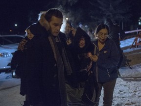 Chris Murphy, a Toronto-based lawyer representing the Boushie family, left, supports Debbie Baptiste, the mother of Colten Boushie, outside of Battleford Court of Queen's Bench on Feb. 9, 2018, after a jury delivered a verdict of not guilty in the trial of Gerald Stanley, the farmer accused of killing the 22-year-old Indigenous man.