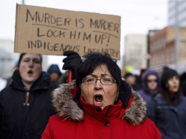 A marcher cries during a rally in response to Gerald Stanley's acquittal in the shooting death of Colton Boushie in Edmonton, Alta., on Saturday, February 10, 2018.
