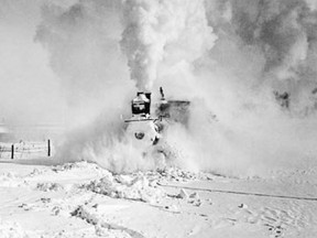 A steam engine struggles through snow drifts in southern Saskatchewan (Provincial Archives of Saskatchewan, R-A27895)