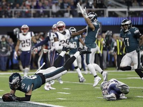 Philadelphia Eagles' Zach Ertz dives into the end zone for a touchdown during the second half of the NFL Super Bowl 52 football game against the New England Patriots Sunday, Feb. 4, 2018, in Minneapolis.