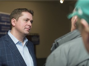 Andrew Scheer speaks to constituents during a town hall meeting at the Country Squire Inn.
