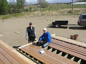 Ken Byers, left, and his father-in-law Norman Hill build a deck on Byers's house in the developing Stonebridge neighbourhood in June of 2008. The field in the background is now a mall. Stonebridge now ranks as Saskatoon's most populous neighbourhood with 11,284 people, according to information in the city's 2017 neighbourhood profiles publication. (Alena Sherwood)