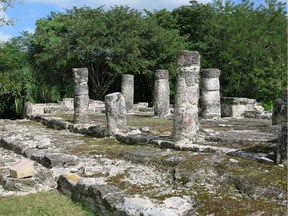 Round pillars are the main feature of the structure called Las Columnas at the Mayan ruins of San Gervasio on Cozumel Island. Pilgrims from the Mayan empire made trips to San Gervasio to pay tribute to Ix Chel, the goddess of the moon and fertility. Las Columnas held several tombs. Gazette photo: David Yates Travel Mexico 0126