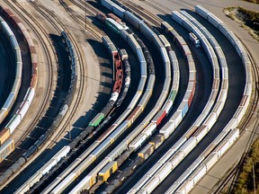 Freight trains and oil tankers sit in a rail yard in this aerial photograph taken above Toronto.