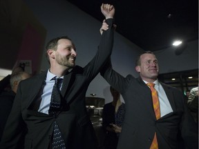 Ryan Meili celebrates alongside NDP leader Trent Wotherspoon at his camp after winning the Saskatoon Meewasin byelection in Saskatoon on Thursday, March 2, 2017.