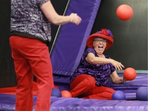 Hella MacDonald, the Queen member of the Red Hat Society, is dressed in her finest dress and bouncing on trampolines at APEX in Saskatoon, SK on March 8, 2018.