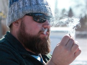 Chris Pratt, a medicinal marijuana smoker, smokes a joint at his home in Saskatoon, SK on March 14, 2018.