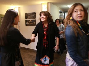 FSIN Vice Chief Kim Jonathan shakes hands with FSIN youth during the FSIN youth assembly Grand Entry at the Travelodge Hotel in Saskatoon, SK on March 21, 2018.