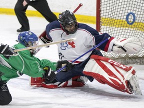 Team Saskatchewan center Bria Bentley dives to take a shot against Team B.C. goalie Enrique Lee during the Western Canadian Ringette Championships U19A gold medal game at Rod Hamm Arena in Saskatoon on Saturday. Team B.C. took gold in both the U19A and U16A divisions, while Team Alberta won in the U14AA division and Team Manitoba in the 18 plus division. Twenty-five teams played in the championships, including eight teams from Saskatchewan.