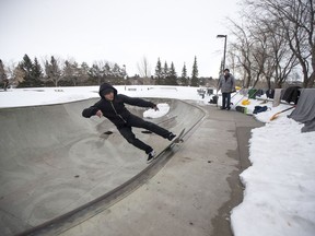 Ben Riabko, left, skateboards in the bowl at the Lions Skatepark in Saskatoon, SK on Saturday, March 24, 2017. Ben Riabko along with Josh Paul, right, and some other friends have been clearing snow out of the bowl to get some skateboarding in during the warmer weather.
