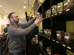 Chris Jordan, managing partner at Best Buds society, behind the counter at the Saskatoon marijuana dispensary.