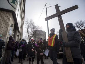 People take part in the Way of the Cross community prayer walk in downtown Saskatoon, SK on Friday, March 30, 2017.