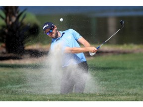 PALM HARBOR, FL - MARCH 11:  Corey Conners of Canada plays a shot from a bunker on the third hole during the final round of the Valspar Championship at Innisbrook Resort Copperhead Course on March 11, 2018 in Palm Harbor, Florida.