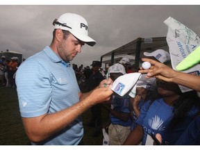 Corey Conners of Canada signs autogrpahs for fans after his final round of the Corales Puntacana Resort & Club Championship on March 25, 2018 in Punta Cana, Dominican Republic.