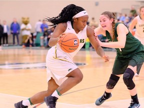 Kyanna Giles of the University of Regina Cougars drives to the basket against the University of Saskatchewan Huskies in the Canada West women's championship game on Friday.
