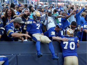Weston Dressler celebrates a touchdown with the Blue Bombers fans during the 2017 season.