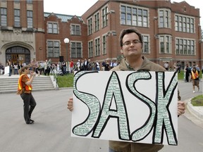 Luke Annand (R) in front of the sound stage and one of the supporters of the Saskatchewan motion picture industry who walked to the Saskatchewan Legislative building in Regina on May 14, 2012 to promote the re-instatement of the Sask. Film Tax Credit. (Don Healy / Leader-Post)