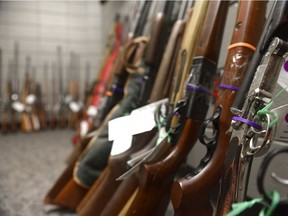 Numerous rifles are displayed during a press conference at Regina Police Service in February 2017. 157 guns turned in through the RPS's gun amnesty program.