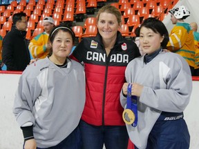 Hayley Wickenheiser poses with members of the national North Korean women's hockey team in Pyongyang, North Korea, on Monday, March 5, 2017.