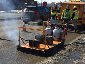 Road crews with the City of Saskatoon were testing out new equipment Thursday on a pothole at the corner of Eighth Street and Arlington Avenue.