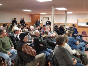 Residents attend an RCMP town hall meeting in Southey on March 28.