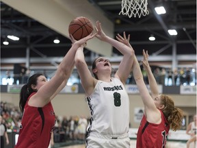 Saskatchewan Huskies centre Kyla Shand (8) goes up for a basket on the Carleton Ravens during the U Sports Women's Basketball final at University of Regina in Regina, Saskatchewan on Sunday March 11, 2018.