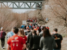 A large crowd taking part in the 2017 Saskatchewan Blue Cross MS Walk in Saskatoon along the Meewasin Trail, which brings communities together in support of raising awareness and funding for ground-breaking multiple sclerosis research.