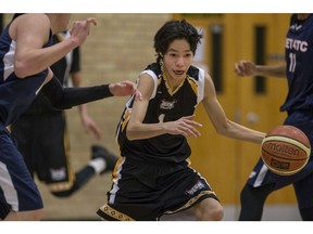 Onion Lake Cree Nation's Cody Singer passes the ball against the South East Treaty 4 Tribal Council team during a basketball game in the Tony Cote First Nations Winter Games at Mount Royal Collegiate in Saskatoon on April 4, 2018.