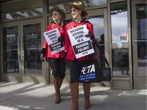 SASKATOON,SK-APRIL 05/2018-0406 Standalone PETA protest- Jessica Klose, left, and Emily Lavender, dressed as PETA's "Mounties", hand out "fashion police tickets" outside of the Midtown Mall in Saskatoon, SK on Thursday, April 5, 2018.