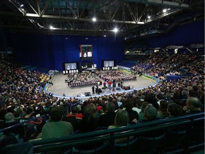 Mourners fill the seats of SaskTel Centre wearing jerseys with Evan Thomas' name on the back, for his memorial service in Saskatoon, Sask., on April 16, 2018.