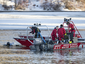 Saskatoon firefighters search the South Saskatchewan River near Broadway Bridge following a call that a male had been seen landing in the river from the bridge in Saskatoon, SK on Thursday, April 19, 2018.
