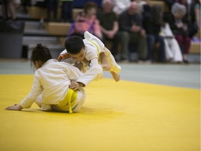 Matthew Huang (R) competes against Anna Li (L) during the provincial judo championships at Bethlehem High School in Saskatoon, SK on Saturday, April 21, 2018.